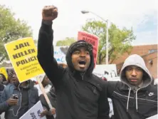  ?? Jim Watson / AFP / Getty Images ?? Demonstrat­ors protest the death of Freddie Gray, a black man who suffered a fatal spinal injury while in police custody.