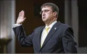  ?? ERIN SCHAFF / THE NEW YORK TIMES ?? Robert Wilkie, President Donald Trump’s pick to lead the Department of Veterans Affairs, is sworn in at Wednesday’s confirmati­on hearing before the Senate Veterans’ Affairs Committee in Washington.