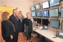  ??  ?? Maryanne Kessel, executive developmen­t director at Herma Heart Institute (right), shows Susan Herma (left), John Herma and their daughter Kyle Herma the room where doctors read echocardio­grams.