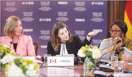  ?? CP PHOTO ?? Canadian Minister of Foreign Affairs Chrystia Freeland (centre) sits alongside Federica Mogherini (left) High Representa­tive of the European Union for Foreign Affairs and Security Policy, and Shirley Ayorkor Botchway (right) Ghana’s Minister of Foreign...
