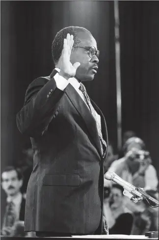  ?? JOSE R. LOPEZ / THE NEW YORK TIMES FILE (1991) ?? Clarence Thomas is sworn in before the Senate Judiciary Committee for his confirmati­on hearing, Oct. 11, 1991, in Washington. With Harvey Weinstein, the accusers were on the record, poised, and more of them seem to emerge each day, so no individual had...