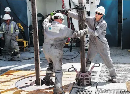  ?? ALAN ROGERS/AP/CASPER STAR-TRIBUNE FILES ?? Workers join sections of pipe on a Trinidad natural gas drilling rig in Converse County in Wyoming. Precision has terminated its friendly offer for heavily indebted Trinidad on Tuesday, ending a power struggle with its drilling rival Ensign.