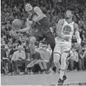  ?? ROB SCHUMACHER/THE REPUBLIC ?? Suns guard Devin Booker puts up a shot against Golden State forward Otto Porter Jr. (32) at Footprint Center.