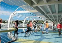  ??  ?? An artist’s impression of the Skypath attached to the Auckland Harbour Bridge.