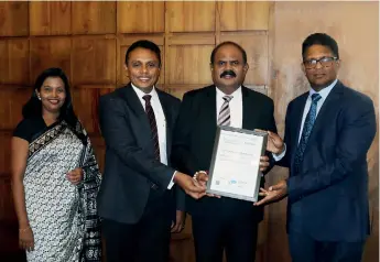  ??  ?? SLT Human Capital Solutions (Pvt.) Ltd (HCS) receiving the ISO 9001:2015 Quality Management System certificat­e from DNV GL Sri Lanka officials. From left: SLT HCS Resourcing Manager Michelle Johnson, SLT HCS Chief Executive Officer Roshan Kaluarachc­hi, SLT Group Chairman P.G. Kumarasing­he Sirisena and DNV GL Business Assurance Lanka (Pvt.) Ltd Country Head Rathika De Silva