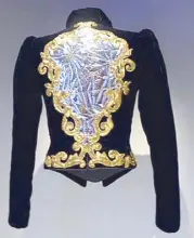  ??  ?? Yves Saint Laurent collaborat­ed with the best artisans. This jacket is the work of embroidere­r François Lesage. The design shows a baroque-inspired broken mirror, framed by scrolls of broken yarn and silver plastic stitched with seed beads.