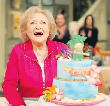  ?? MARK DAVIS/GETTY IMAGES ?? Betty White, seen here celebratin­g her 93rd birthday on the set of Hot in Cleveland, is happy to keep busy working.
