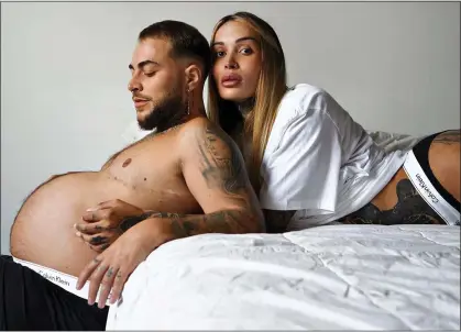  ?? ?? FASHION STATEMENT: Pregnant trans man Roberto Bete with partner, trans woman Erica Feeha, in the Calvin Klein ad