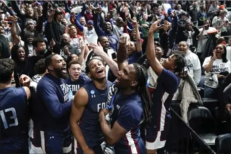  ?? PAUL SANCYA — THE ASSOCIATED PRESS ?? Fairleigh Dickinson players celebrate beating Purdue 63-58 after a first-round college basketball game in the NCAA Tournament Friday, March 17, 2023, in Columbus, Ohio.