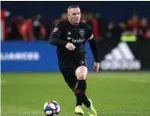  ?? — AFP ?? Wayne Rooney of D.C. United dribbles the ball during an MLS game against Toronto FC on Saturday.