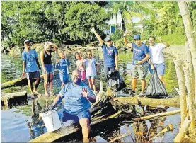  ?? Picture: JONA KONATACI ?? Families, friends and members of the Steering Fiji Women’s Seafarers Associatio­n clean up at Suva Point on Saturday.