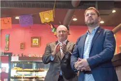  ??  ?? Rep. Ruben Gallego, right, who contemplat­ed a run for the Senate in 2020, is now campaignin­g for his one-time potential rival, Mark Kelly.