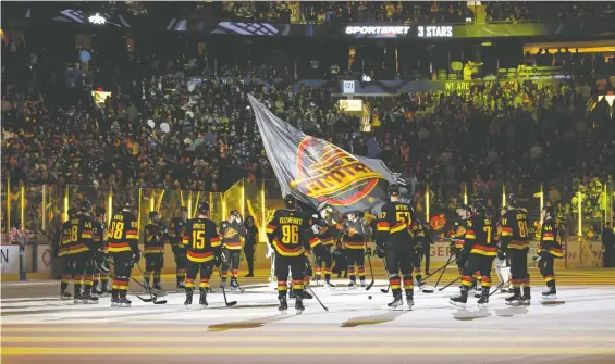  ?? DEREK CAIN/GETTY IMAGES FILES ?? The Canucks salute their fans after the last game of the season at Rogers Arena. The team has a tough selling job to convince fans better times are ahead.