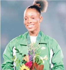  ?? ?? Chioma Ajunwa after she was decorated with her gold medal in long jump at the 1996 Olympic Games in Atlanta, USA