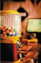  ?? ?? rather than bright balls of bubble gum, the old gumball machines now contain capsules of seeds to grow wild flowers that will help bees. — 123rf.com