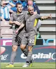  ??  ?? OPENER: Gary Taylor-Fletcher and Chris Wood celebrate