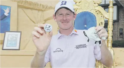  ?? Picture: AFP ?? IN HIS ELEMENT. Brandt Snedeker poses with the ball and glove he used when he shot 59 during the first round of the Wyndham Championsh­ip in Greensboro, North Carolina on Thursday.