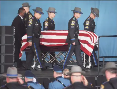  ?? Brian A. Pounds / Hearst Connecticu­t Media ?? State troopers carry the casket of fellow trooper Sgt. Brian Mohl into his funeral service at the Xfinity Theatre in Hartford on Thursday.