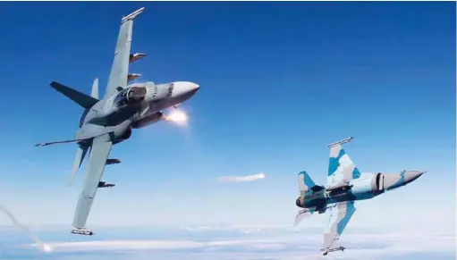  ??  ?? A RAAF’s F/A-18 Hornet and a USAF’s F-16 Viper and in a training sortie