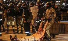  ??  ?? A law enforcemen­t officer drags a man during clashes with opposition supporters after poll closed at presidenti­al election in Minsk, Belarus on Sunday. Photograph: TUT.BY/Reuters