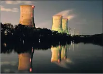  ?? [ASSOCIATED PRESS FILE PHOTO] ?? In this Nov. 2, 2006, photo, cooling towers of the Three Mile Island nuclear power plant are reflected in the Susquehann­a River in this image taken with a slow shutter speed in Middletown, Pa.