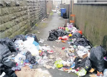  ??  ?? Fly Tipping on Labernum Street, Haslingden, prior to a council clean-up in January