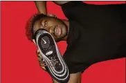  ?? MSCHF VIA THE NEW YORK TIMES ?? In an undated image provided by MSCHF, the rapper Lil Nas X with “Satan Shoes,” a collaborat­ion between the company MSCHF and the rapper. The rapper’s new single, video and sneaker were merely the prelude to a brilliantl­y orchestrat­ed main event: a virtuosic performanc­e on Twitter.