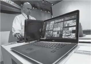  ?? ASSOCIATED PRESS FILE PHOTO ?? A Dell laptop computer running Windows 10 is on display at the Microsoft Build conference in San Francisco.