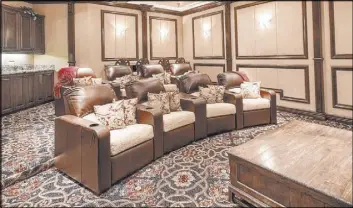  ??  ?? The home has an entertainm­ent level with a home theater and game room.