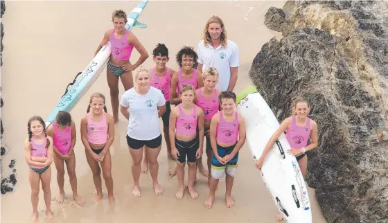  ?? Picture: SUPPLIED ?? Leading surf lifesaving pair Matt Davis and Prue Davies with Gold Coast Nippers.