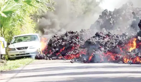  ?? — Reuters photo ?? Lava engulfs a Ford Mustang in Puna in this still image obtained from social media video.