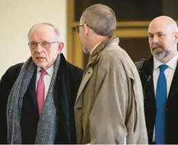  ?? BRIAN CASSELLA/CHICAGO TRIBUNE ?? James Franczek, left, the city’s chief labor negotiator, departs after a court hearing in a Fraternal Order of Police lawsuit about how misconduct cases are handled in their contract on Wednesday at the Daley Center.