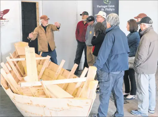  ?? GLEN WHIFFEN/THE TELEGRAM ?? Master boat builder Jerome Canning of the Wooden Boat Museum of Newfoundla­nd and Labrador explains the process of building a wooden dory to participan­ts of a workshop in Portugal Cove/st. Philip’s Monday afternoon.