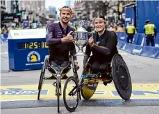  ?? Steven Senne/associated Press ?? Marcel Hug, left, of Switzerlan­d, won the Boston Marathon men’s wheelchair division and Eden Rainbow Cooper, of Britain, captured the women’s wheelchair division. Hug withstood a spill at the 18-mile mark to maintain his lead.