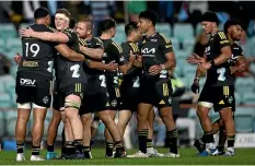  ?? GETTY IMAGES ?? Hurricanes players show their delight at their lastgasp win over the Waratahs in Sydney on Saturday.