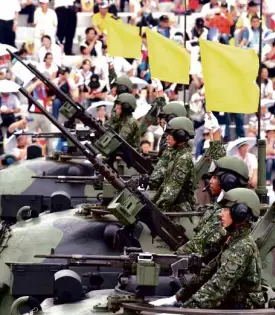  ?? AFP ?? SOLDIERS salute during the 70th anniversar­y of the World War II at the Huko military in northern Hsinchu on July 4.