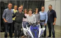  ?? SUBMITTED PHOTO — TURN5 ?? Turn5 recently put the graphics on an ATV for a Make-A-Wish recipient from Collegevil­le. From left starting in front row: Andrew Voudouris, Turn5 co-founder; Dennis Heron of Make-AWish; Seth Willis; Lisa Willis, Seth’s mother; Brian Willis, Seth’s...