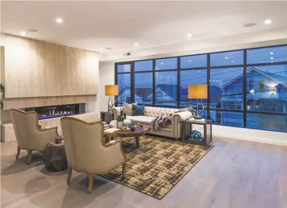  ?? Olga Soboleva / Vanguard Properties ?? Slabs of Italian travertine finish the living area’s fireplace at 1188 Diamond St., a five-bedroom in Noe Valley.