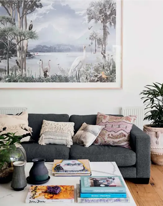  ??  ?? LIVING ROOM Greenery in all forms thrives throughout Tammy and Jonathan’s home and is a simple and affordable option to lift any space (try Garden Life or The Soul Pantry for similar plants, pots and terrariums). “I like to bring the outdoors in, as it...