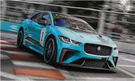  ??  ?? Jaguar’s first all-electric production car, the I-PACE, has benefited from lessons learned on the Formula E circuit.