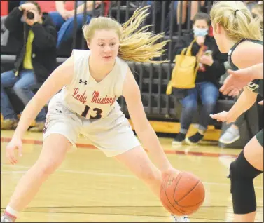  ?? RICK PECK/SPECIAL TO MCDONALD COUNTY PRESS ?? McDonald County freshman guard Carlee Cooper tries to get around Mount Vernon’s Ellie Johnston during the Lady Mountainee­rs 84-32 win on Feb. 19 at MCHS.