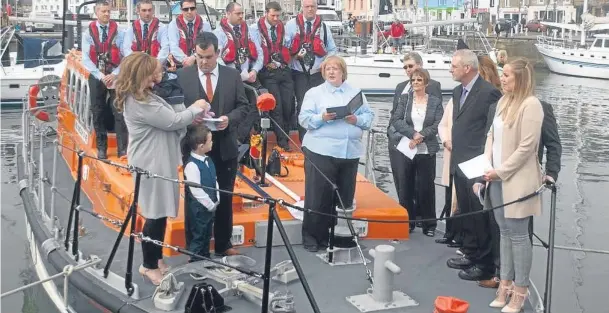  ??  ?? The christenin­g ceremony on board the Anstruther lifeboat, the Kingdom of Fife.