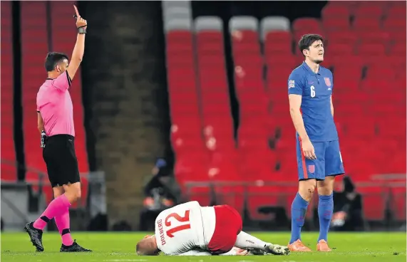  ?? Picture: Daniel Leal Olivas/PA ?? England’s Harry Maguire is sent off by referee Jesus Gil Manzano at Wembley last night