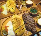  ??  ?? Trey’s Barn and Grill, an alfresco steakhouse, serves specialty meats directly from the family ranch.