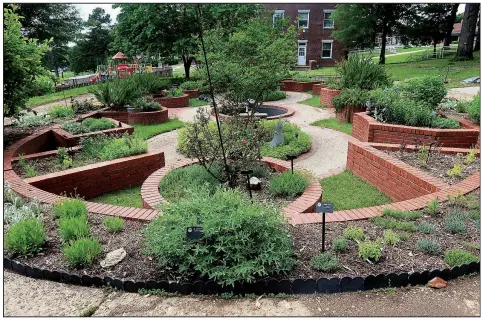  ??  ?? The Arkansas Herb Unit created and maintains this Garden of Exploratio­n at the Arkansas School for the Blind and Visually Impaired in Little Rock.