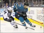  ?? JEFF CHIU — ASSOCIATED PRESS ?? The Sharks’ Tomas Hertl goes for the puck ahead of the Jets’ Josh Morrissey during the second period of San Jose’s 4-0 win on Saturday.