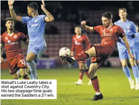  ??  ?? Walsall’s Luke Leahy takes a shot against Coventry City. His two stoppage-time goals earned the Saddlers a 2-1 win.