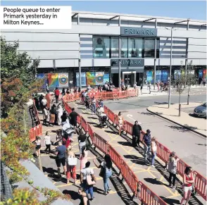  ??  ?? People queue to enter Primark yesterday in Milton Keynes...