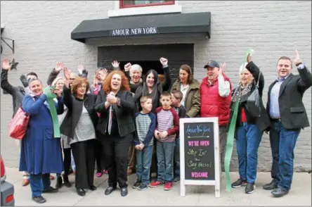  ?? LAUREN HALLIGAN — LHALLIGAN@DIGITALFIR­STMEDIA.COM ?? Event-goers celebrate the grand opening of Amour New York on Tuesday at a ribbon cutting ceremony with the Saratoga County Chamber of Commerce.