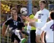  ?? BOB RAINES--DIGITAL FIRST MEDIA ?? North Penn’s Eric Szilagyi, left, and Henderson’s Aiden McFadden battle for a ball in front of the North Penn goal.